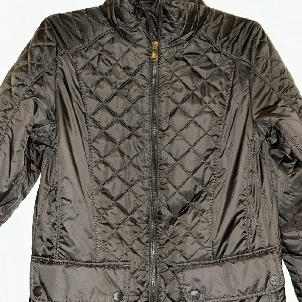 The North Face Women’s water-resistant, insulated jacket, with pockets.
